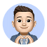 Digital avatar of a smiling person with short brown hair, wearing a blue shirt, forming a heart shape with their hands against a light blue circular background.